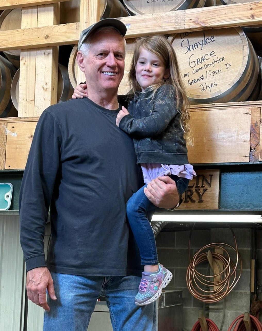 Kim McLaughlin and his granddaughter at McLaughlin Distillery.